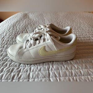 Nike White Low-Top Sneakers with Pale Yellow Swoosh